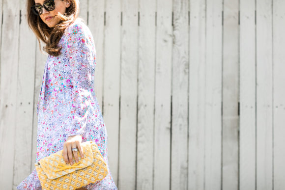 Amy Havins wears a Shoshanna floral print summer dress.