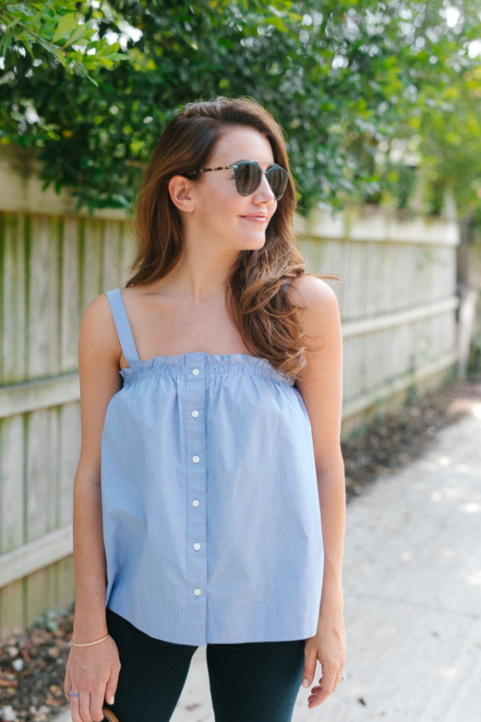 Amy Havins wears a pinstriped top and jeans.