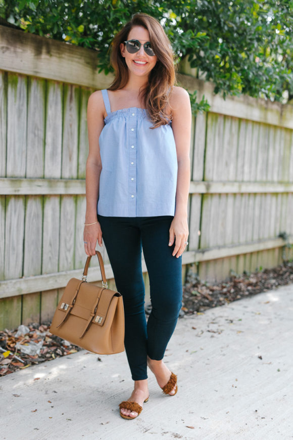 Amy Havins wears a pinstriped top and jeans.