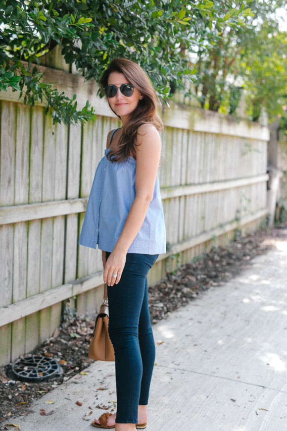 Amy Havins wears a pinstriped top and jeans.