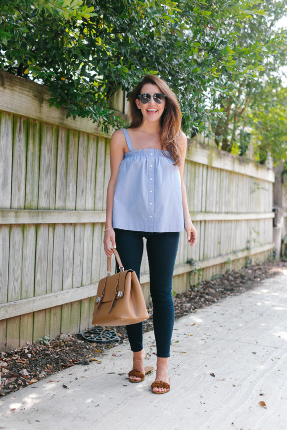 Amy Havins wears a pinstriped top and jeans.