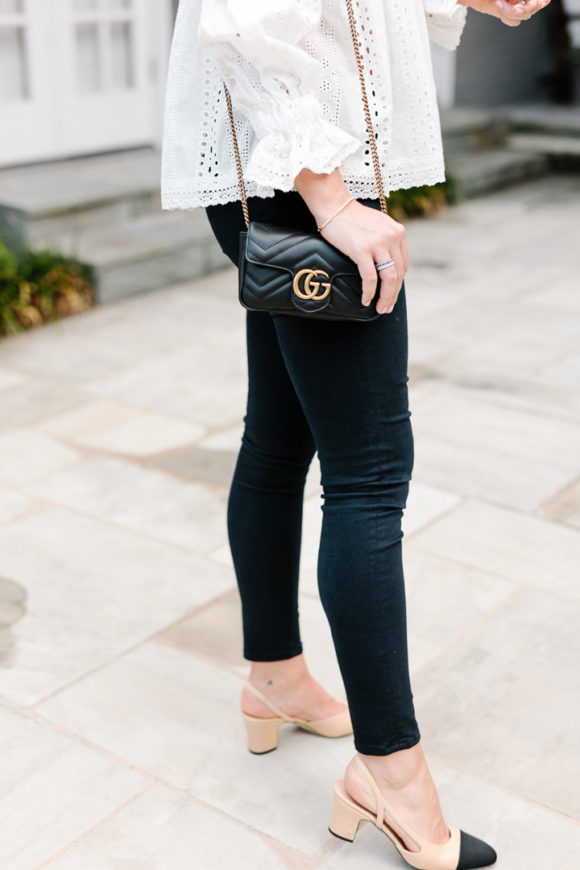 Amy Havins wears jeans and white off the shoulder blouse.