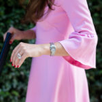 Amy Havins wears a pink shoshanna flutter sleeve dress.