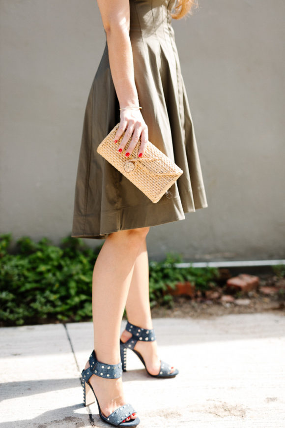 Amy havins wears a green fit & flare dress.