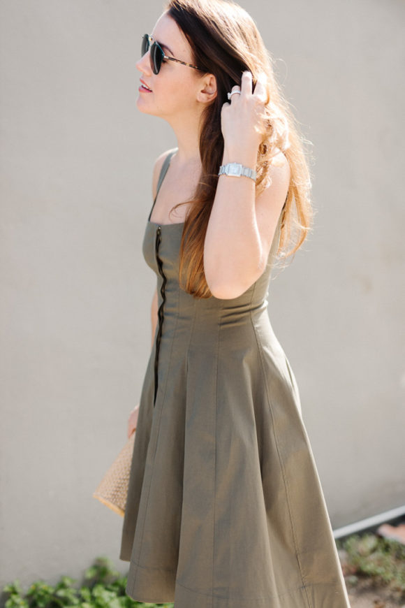 Amy havins wears a green fit & flare dress.