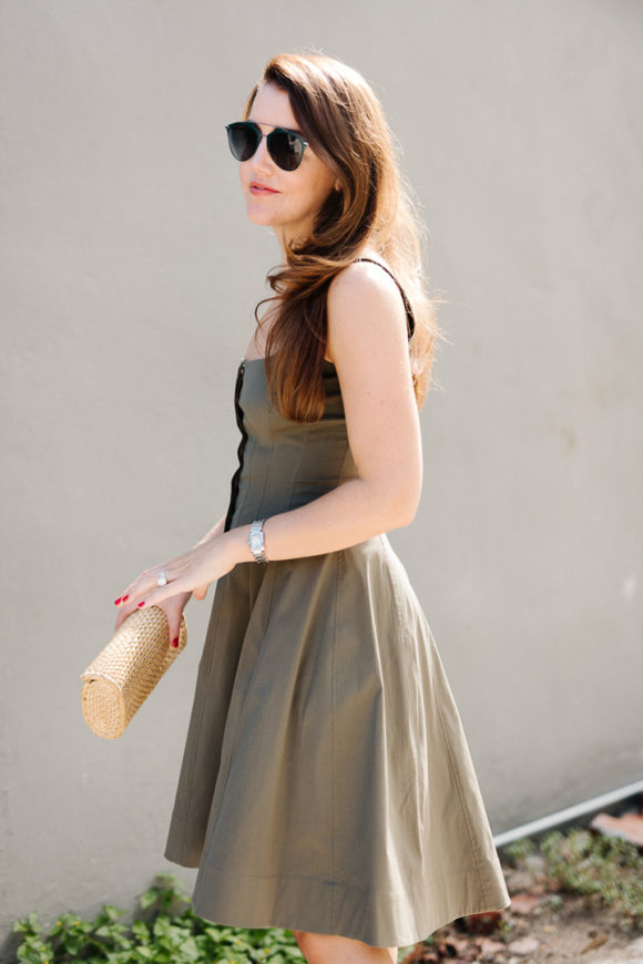 Amy havins wears a green fit & flare dress.