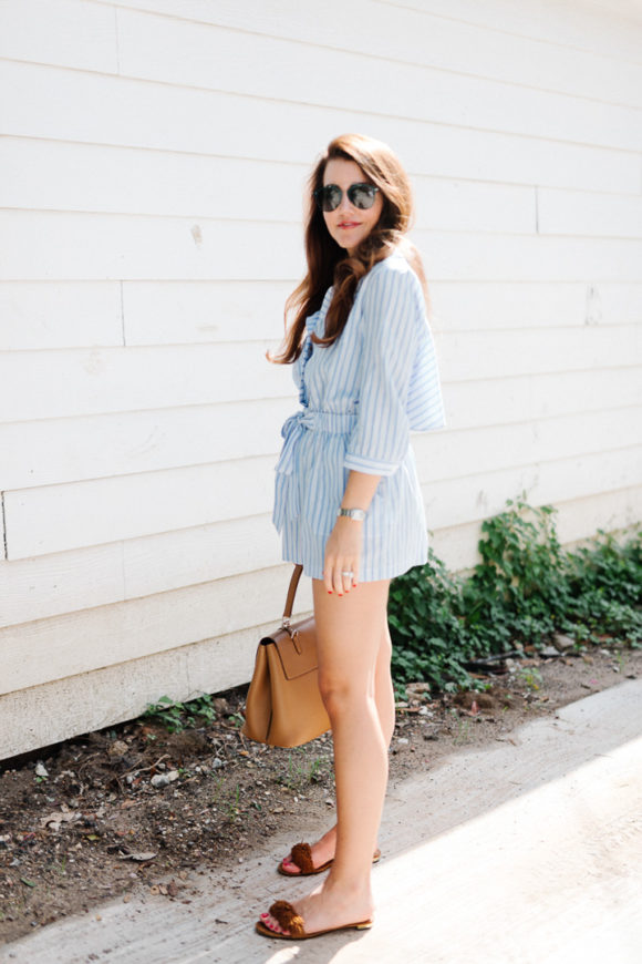 Amy Havins wears a blue and white romper.