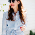 Amy Havins wears a blue and white romper.