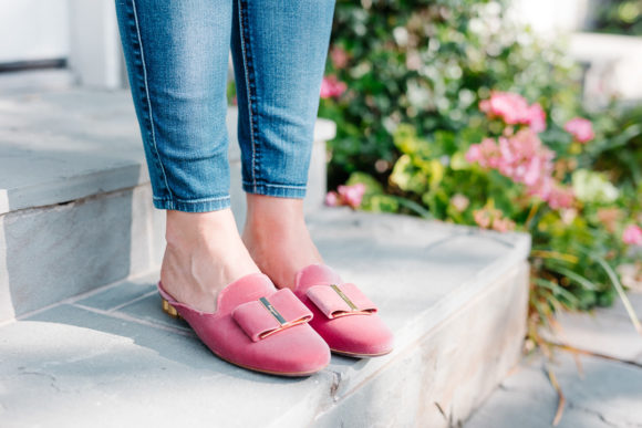 Amy Havins wears a blush blouse, ripped jeans and velvet flats.