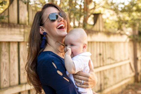 Amy Havins wears a navy shoshanna dress with baby ralph.