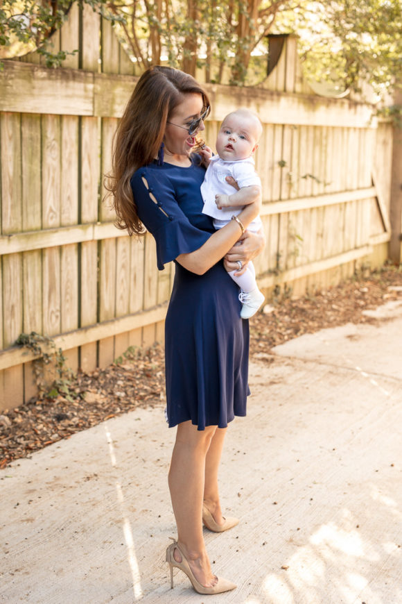 Amy Havins wears a navy shoshanna dress with baby ralph.