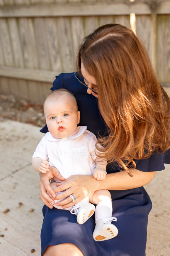 Amy Havins wears a navy shoshanna dress with baby ralph.