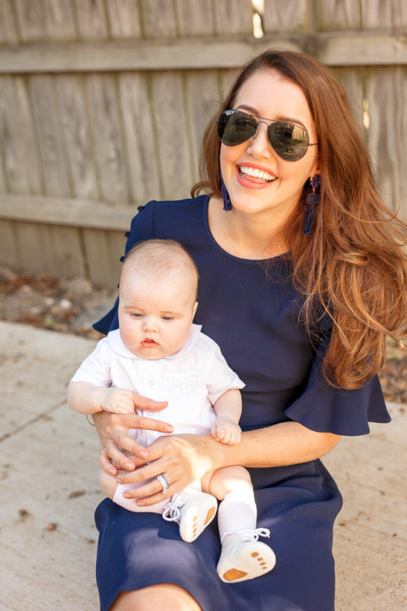 Amy Havins wears a navy shoshanna dress with baby ralph.