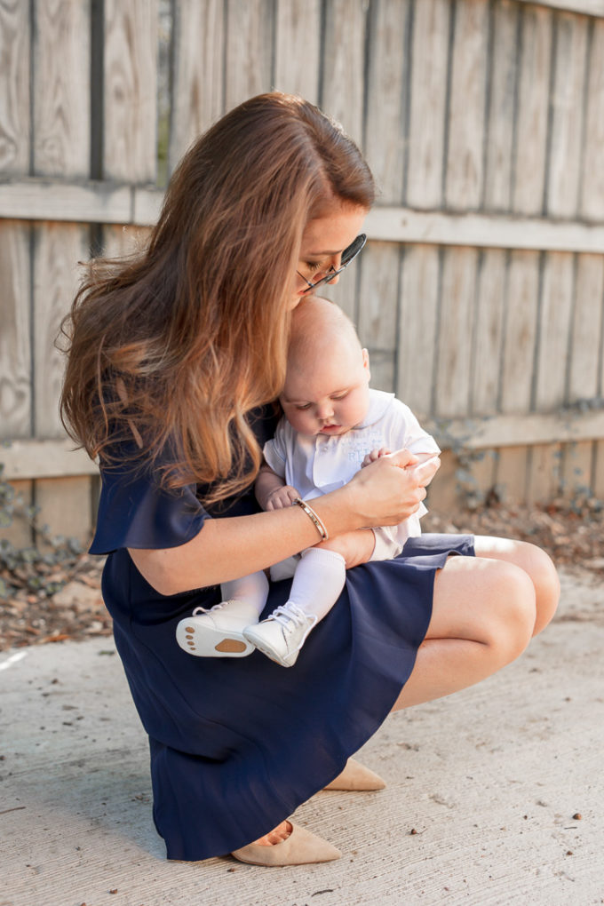 Amy Havins wears a navy shoshanna dress with baby ralph.