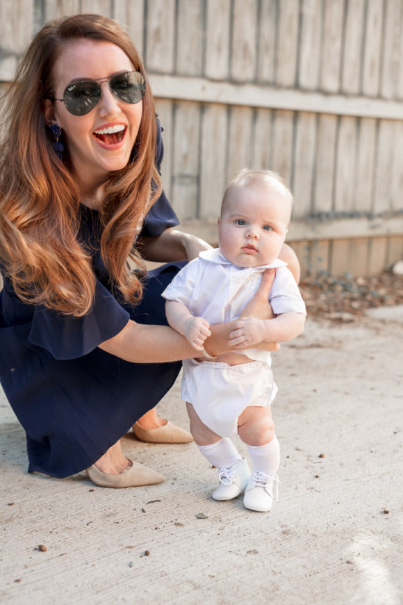 Amy Havins wears a navy shoshanna dress with baby ralph.