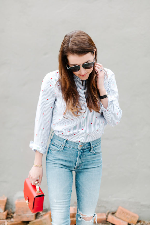 Amy Havins wears jeans and a button down.