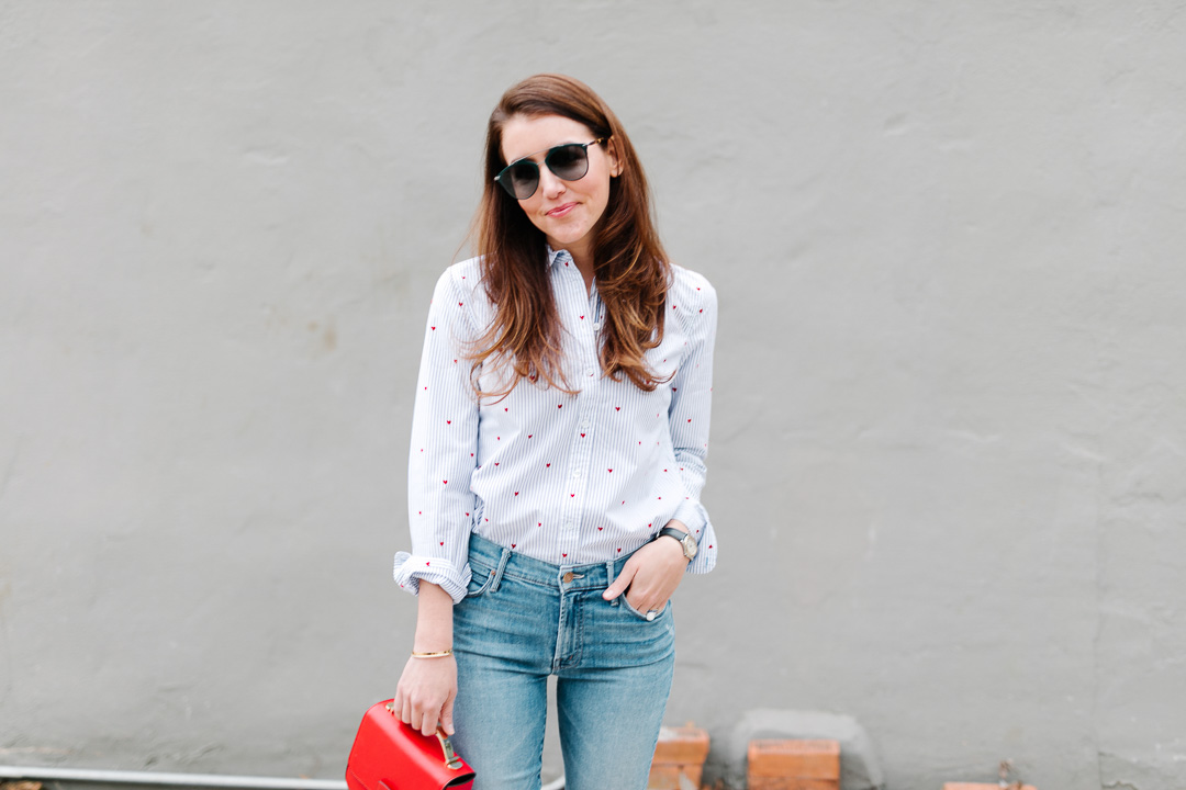 Amy Havins wears jeans and a button down.