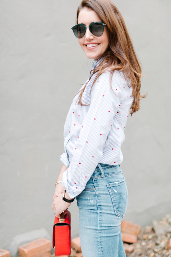 Amy Havins wears jeans and a button down.