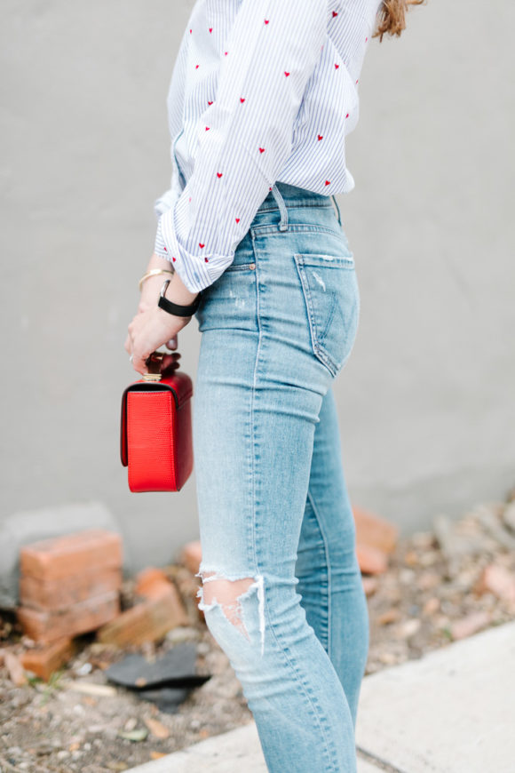 Amy Havins wears jeans and a button down.