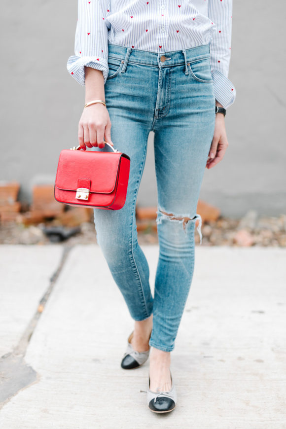 Amy Havins wears jeans and a button down.