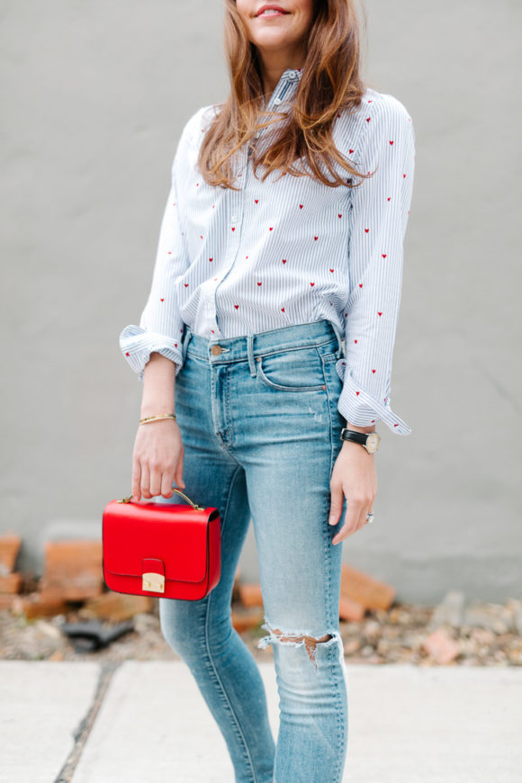 Amy Havins wears jeans and a button down.