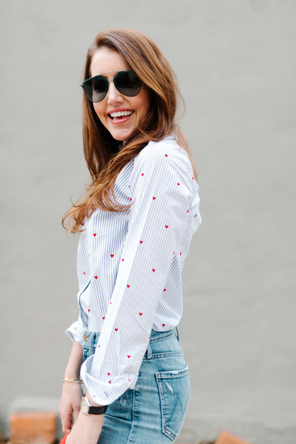 Amy Havins wears jeans and a button down.