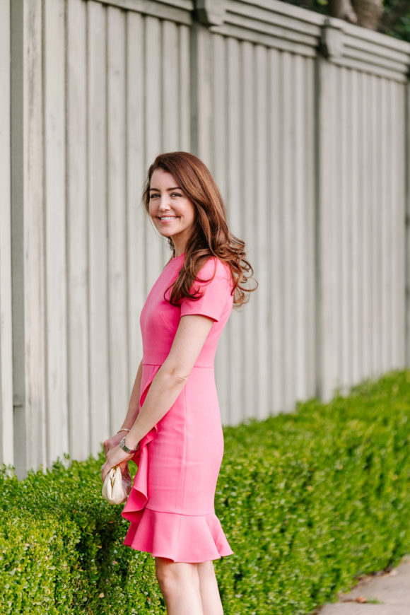 Amy Havins wears a spring pink shoshanna dress.