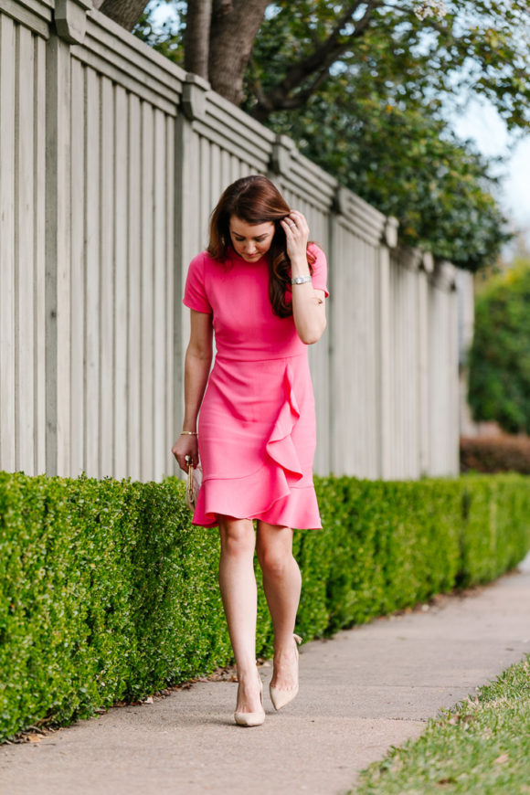 Amy Havins wears a spring pink shoshanna dress.