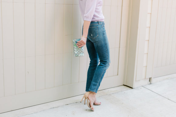 Amy Havins wears a purple tiki top and jeans.