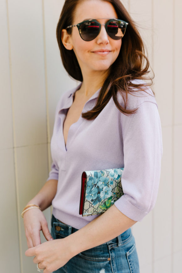 Amy Havins wears a purple tiki top and jeans.