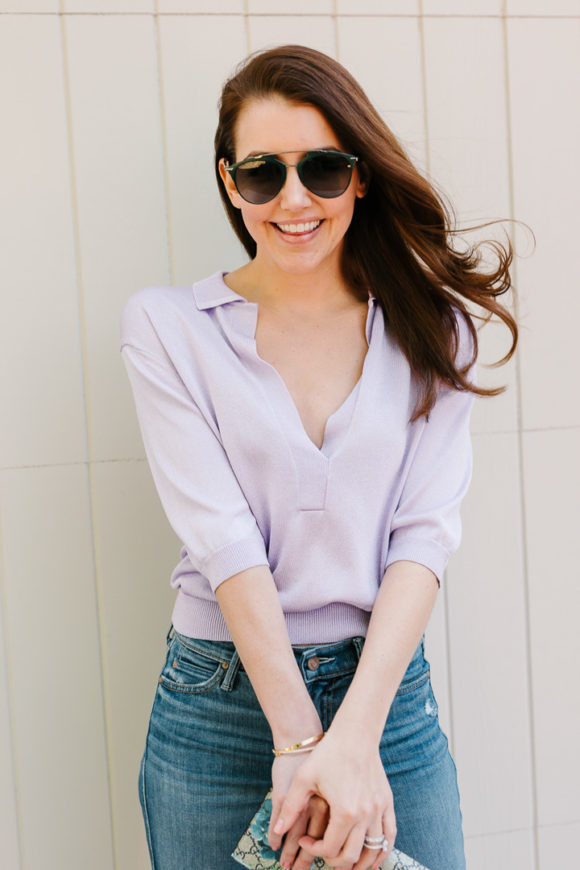 Amy Havins wears a purple tiki top and jeans.