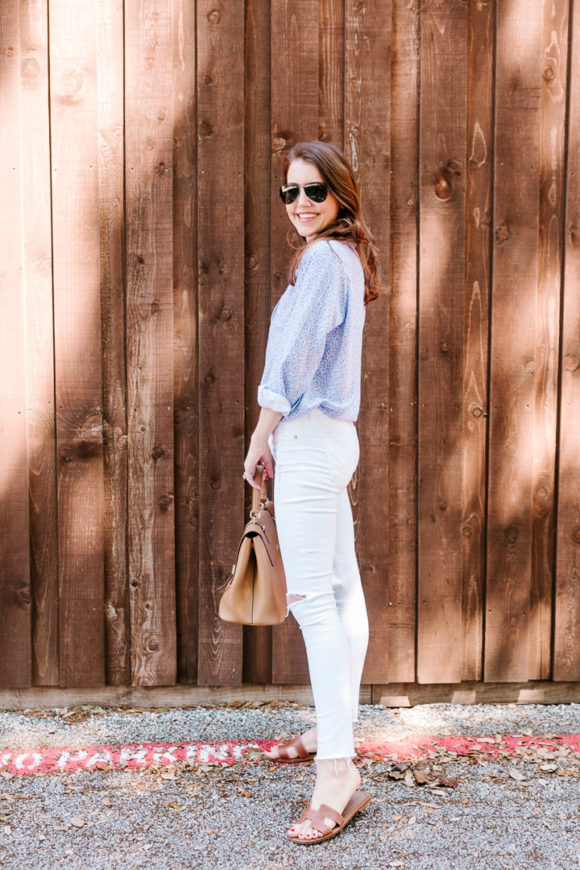 Amy Havins wears white jeans and a floral frank and eileen button down.