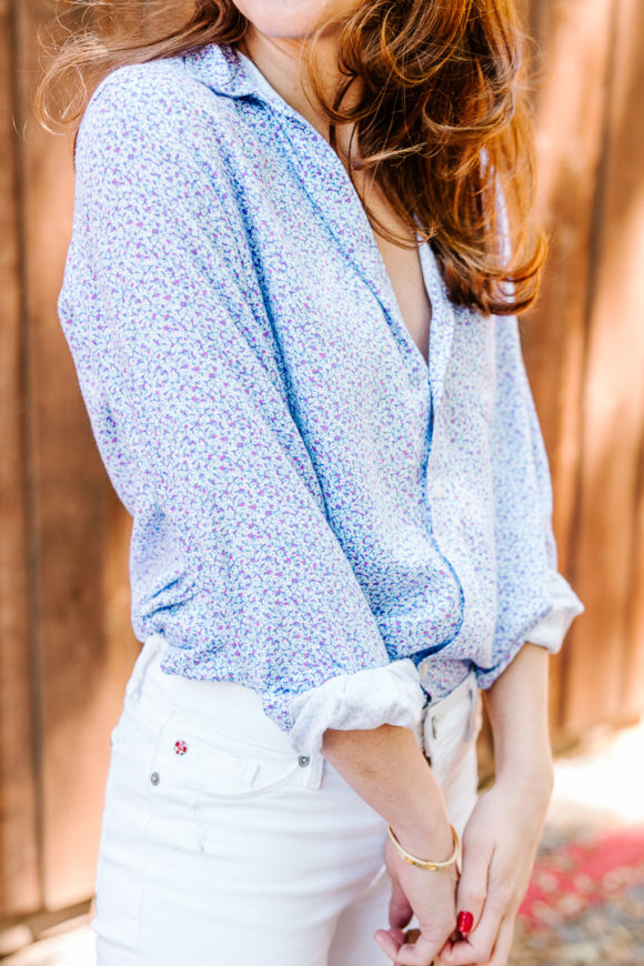 Amy Havins wears white jeans and a floral frank and eileen button down.