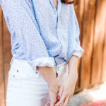 Amy Havins wears white jeans and a floral frank and eileen button down.