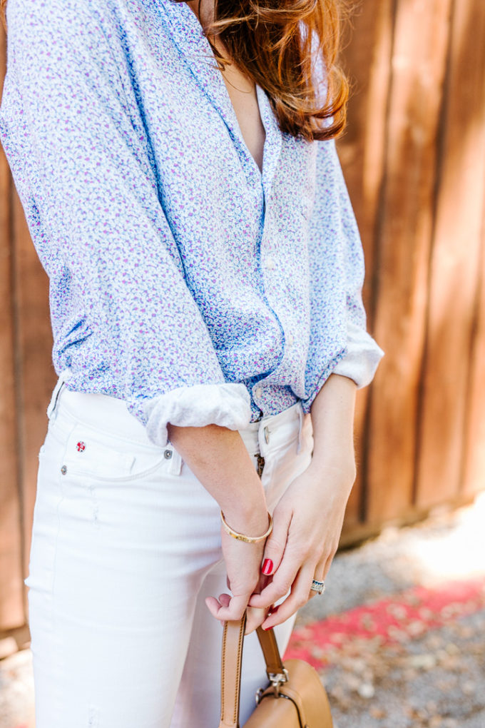 Amy Havins wears white jeans and a floral frank and eileen button down.