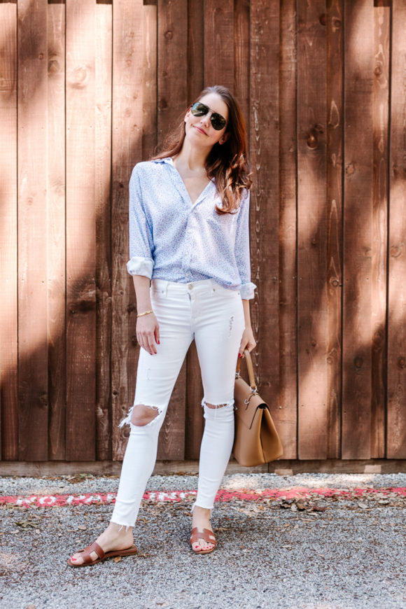 Amy Havins wears white jeans and a floral frank and eileen button down.