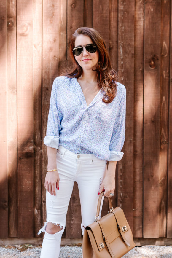 Amy Havins wears white jeans and a floral frank and eileen button down.