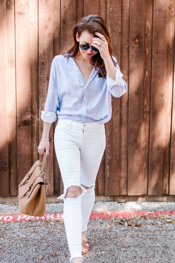 Amy Havins wears white jeans and a floral frank and eileen button down.