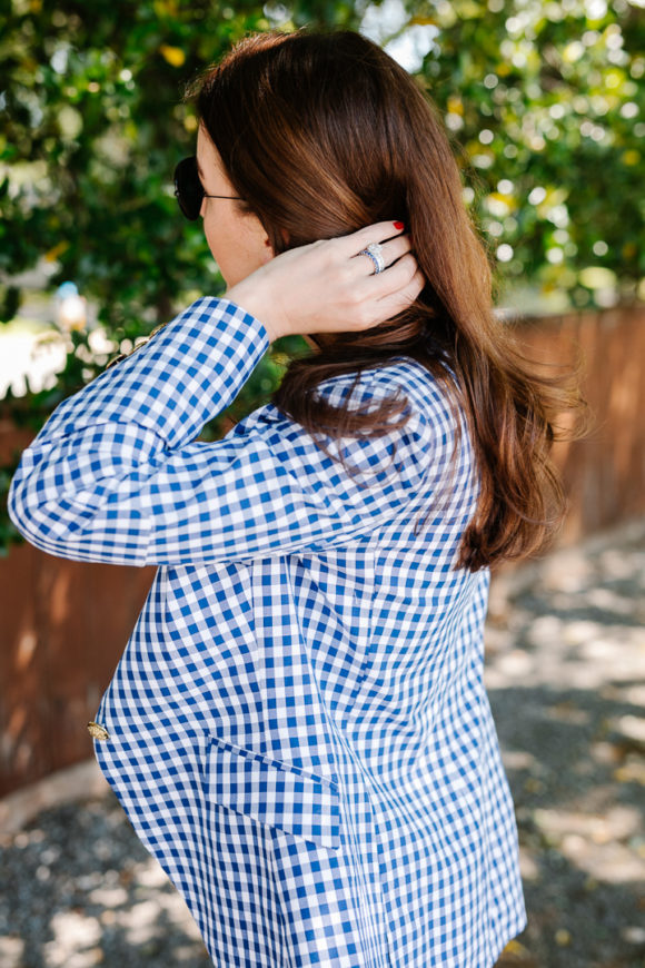 amy havins wears a gingham blazer.