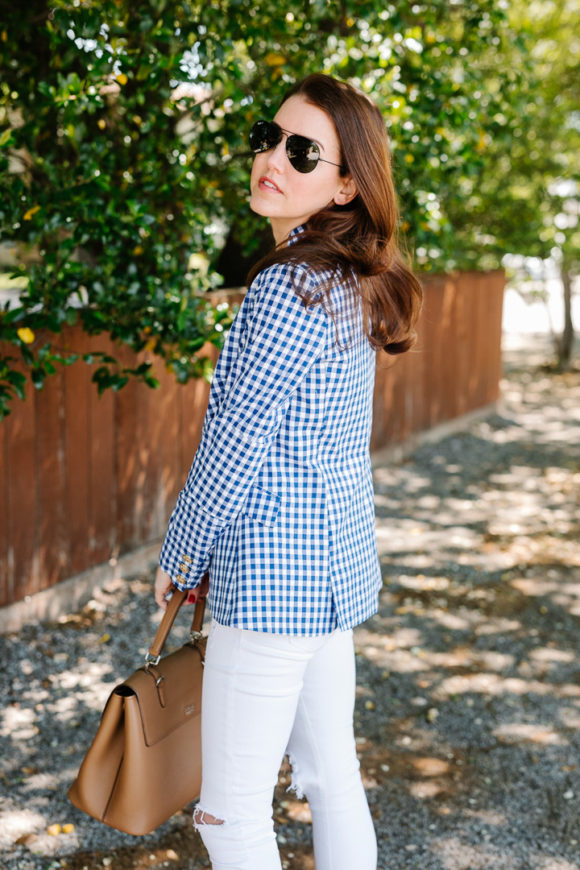 amy havins wears a gingham blazer.