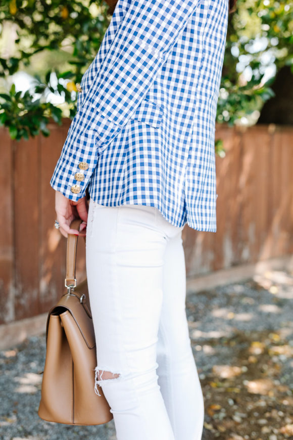 amy havins wears a gingham blazer.