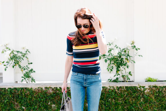 Amy havins wears a striped top and jeans.