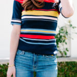 Amy havins wears a striped top and jeans.