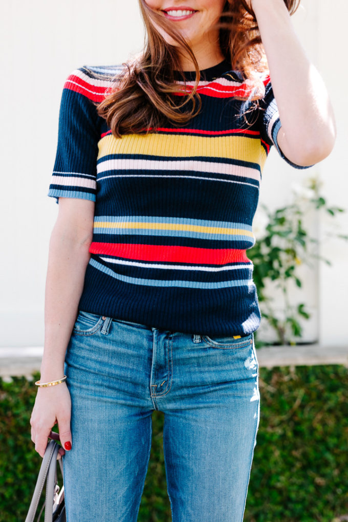 Amy havins wears a striped top and jeans.