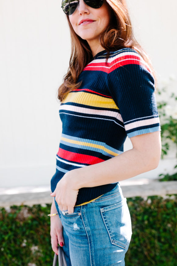 Amy havins wears a striped top and jeans.