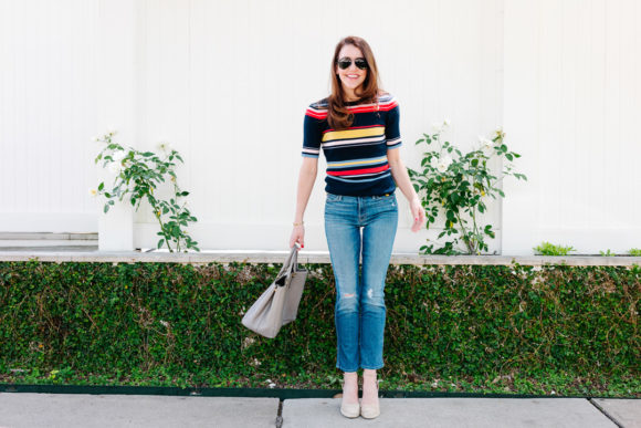 Amy havins wears a striped top and jeans.