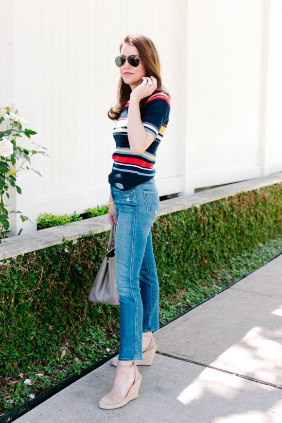 Amy havins wears a striped top and jeans.