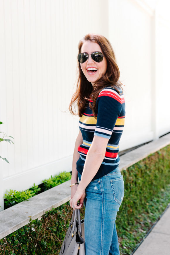 Amy havins wears a striped top and jeans.