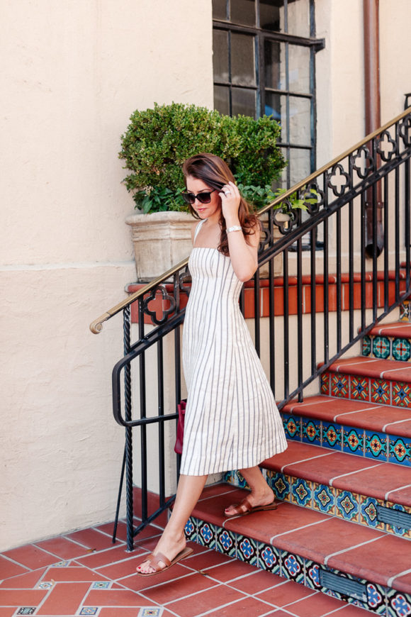 Amy Havins wears a theory stripe dress.