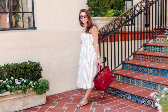 Amy Havins wears a theory stripe dress.